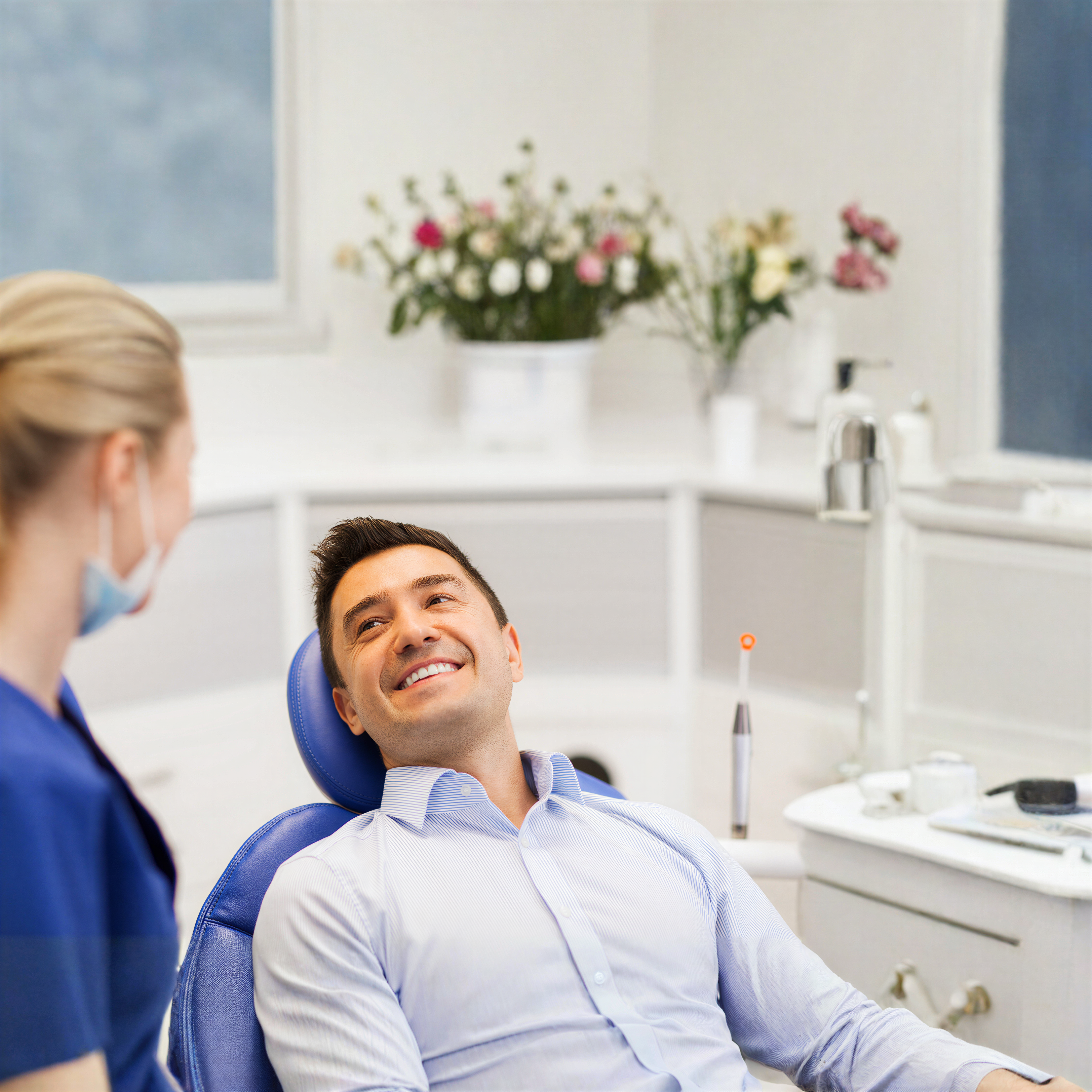 Friendly Rocky Mountain Dental front-desk team helping a NIHB patient