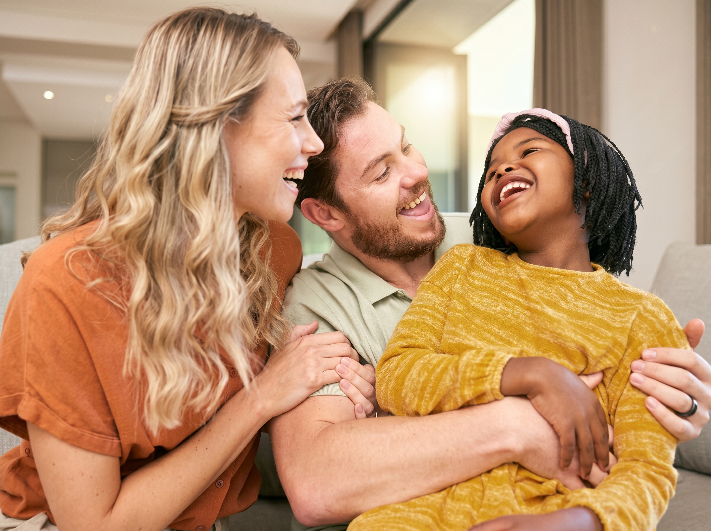 A multigenerational Banff family sharing a warm, laughing moment together